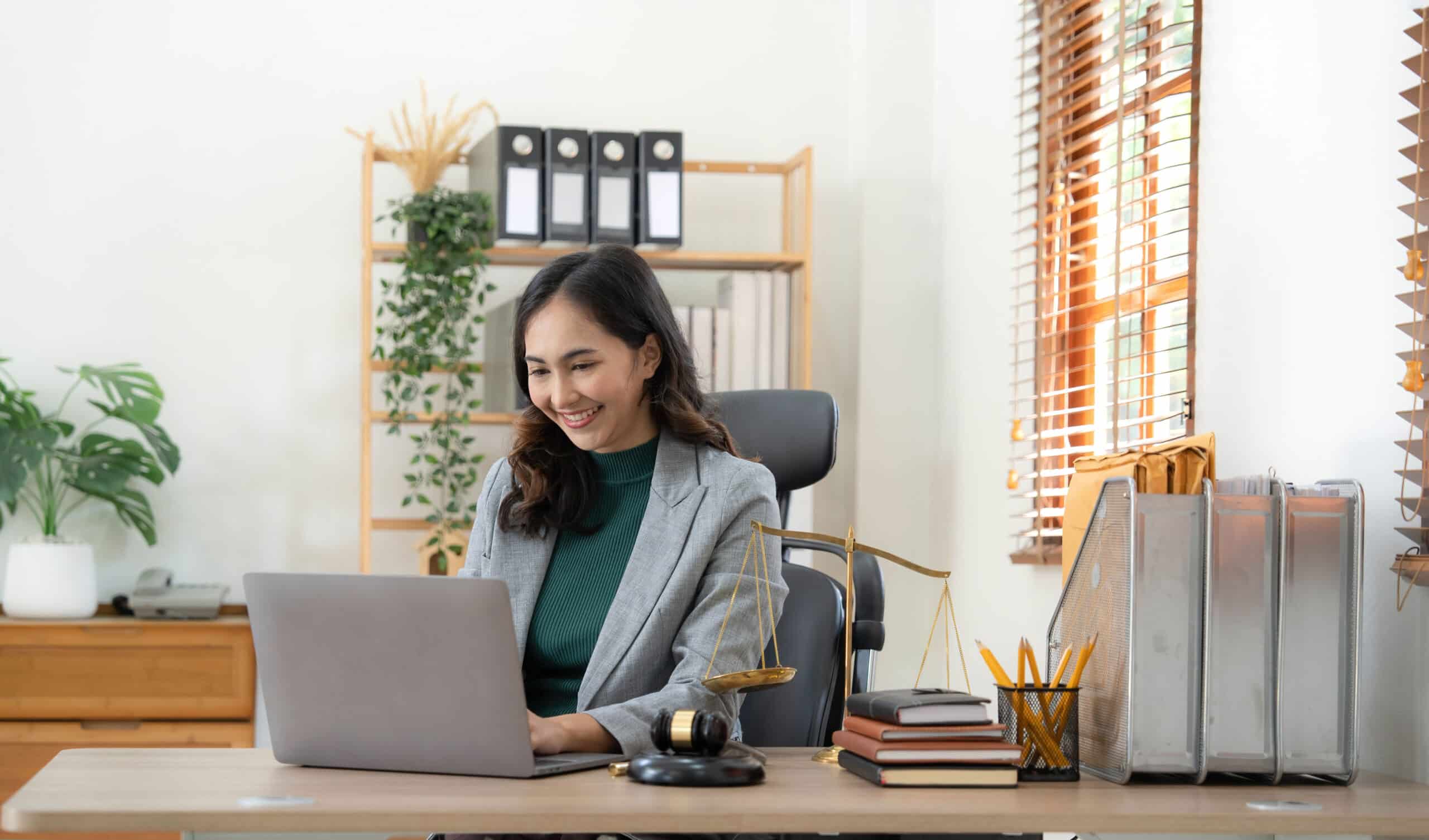 asian business lawyer woman working with computer 2022 10 19 22 20 10 utc scaled