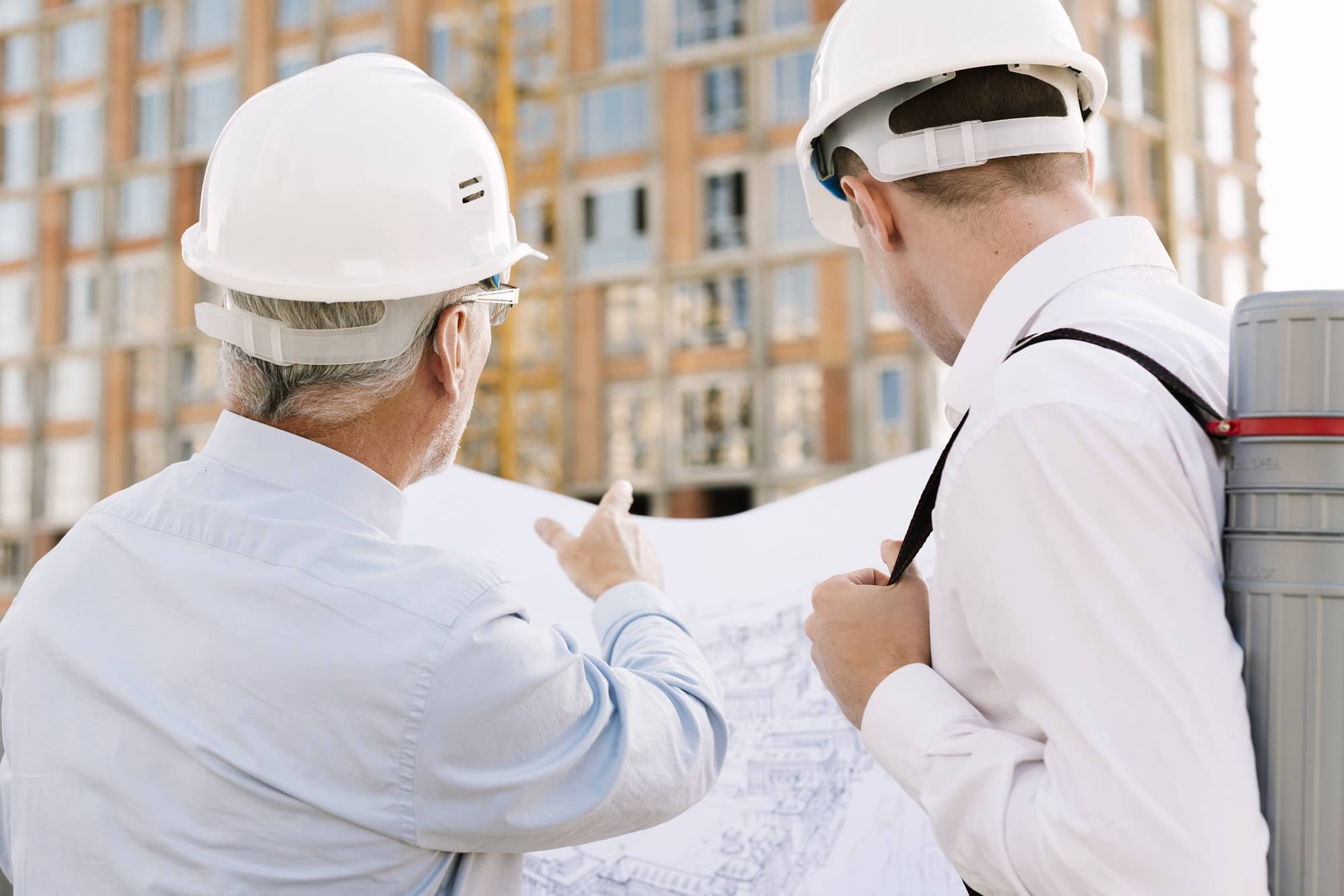 back view men looking building design 1